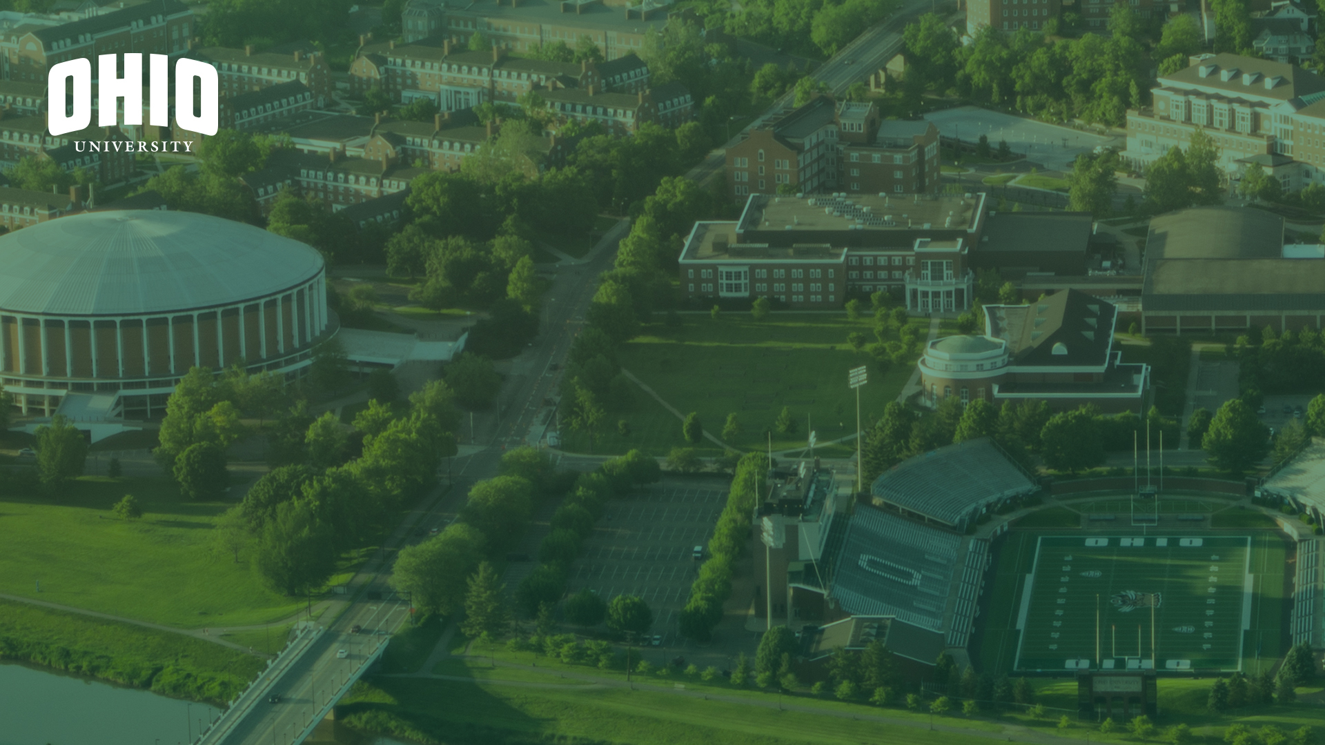 Aerial photograph with a green overlay overlooking the Convocation Center and Peden Stadium